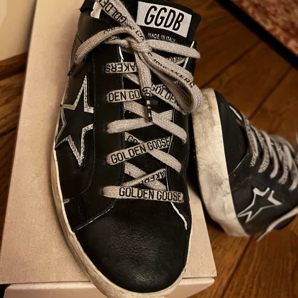 GG Super-Star low top sneaker. Black with black star outlined in silver.